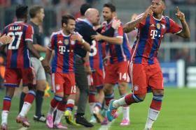 Bayern Munich&#039;s defender Jerome Boateng celebrates after scoring the only goal in the first leg UEFA Champions League Group E football match against Manchester City in Munich. 
