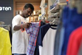 CELEBRATIONS: Mr Anand Atti Gadda shopping for new clothes for Deepavali.