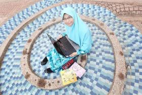 INTELLIGENT: Miss Majiidah Khamsani came from a family that often competed in Quran recital competitions.