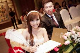 HAPPY TOGETHER: Mr and Mrs Chris Lim at their solemnization ceremony in March this year.