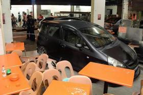 NARROW ESCAPE: The car crashed into tables and chairs, just missing the coffeeshop boss.