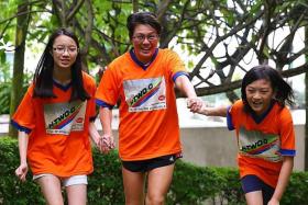 FAMILY BONDING: (From Left) Michelle Han, 13, Madam Dawn Teo, 45, and Amelia Han, nine.