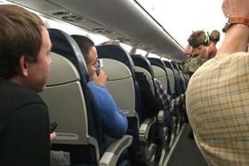 A woman was asked to leave a plane after the pig she was travelling with became disruptive.