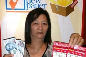 PLEASED: Madam Tang Hwa May won $200 playing the TNP Bonus Challenge.