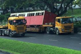 NEWS ALERT: Mr Ian Lim called The New Paper&#039;s hotline after the container at the back of the trailer truck fell off at Clementi Road.