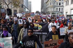Demonstrators in Oakland, California marching against police violence on Dec 13.