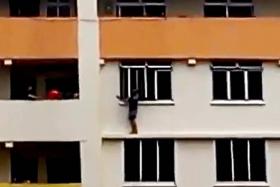 WINDOW-STOPPER: A worried resident called the police after seeing this elderly man standing on the ledge of the 10th storey of Block 408, Tampines St 41.