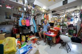 DIY PROJECTS: Mr Yee is fond of installing hooks to hang his bags and clothes. 