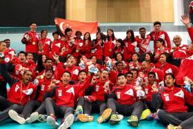 DESERVING CHAMPIONS: Singapore floorball players (in red and white) didn&#039;t disappoint fans with their exciting finish to both finals.