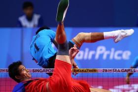 MIGHTY MYANMARESE: (Above) Latt Zaw executes an acrobatic return against the Philippines.   