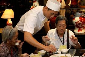 CHEF: Qi Yuwu (above) made herbal soup and steamed egg for the senior citizens. 