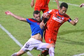 NO QUARTER GIVEN: Balestier&#039;s Tarik Cmajcanin (left) challenging Albirex&#039;s Shun Inaba during last night&#039;s game at the Jurong East Stadium.