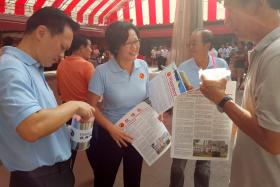 The Workers&#039; Party&#039;s Sylvia Lim (second from left) at Chong Pang Market and Food Centre on Aug 16, 2015. 