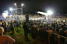 RAPT AUDIENCE: The crowd that gathered at the Hougang Central open field yesterday.