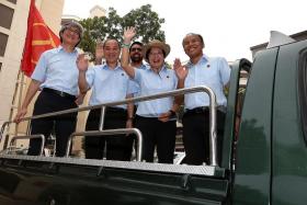 WINNERS: The Workers&#039; Party team in Aljunied GRC, made up of (from left) Mr Chen Show Mao, Mr Low Thia Khiang, Mr Pritam Singh, Miss Sylvia Lim, and Mr Muhamad Faisal Abdul Manap, before their Thank-you Procession yesterday.