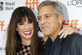  Actress Sandra Bullock and producer George Clooney arrive for the premiere of Our Brand Is Crisis at the Toronto International Film Festival (TIFF) 