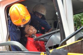 RESCUED: A trailer driver was trapped after his vehicle collided with a truck on the AYE yesterday. It took SCDF rescuers almost an hour to free the driver from the cabin.