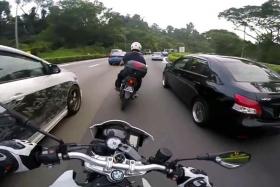 SPEEDING:  The biker was filmed speeding through traffic and squeezing between cars, seemingly without slowing down as he travelled on the PIE and BKE.