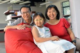 Above: With her parents, Mr Astro Chang and Madam Jackie Lee.