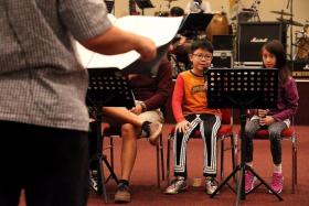 TALENTED: Isaiah rehearsing with other performers for the ChildAid concert.