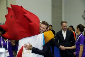 David Beckham surprised Asean Para Games athletes in Singapore on Dec 6, 2015. Here, he hugs a lucky Nila.