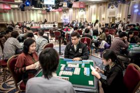 Contestants taking part in the World Series of Mahjong championship in Macau.