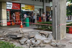 STRUCTURALLY SAFE: The cladding from the overhead bridge outside Orchard Plaza fell at 3.20am yesterday. 