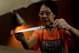 Madam Lee Hwee Chin, 68, is one of the last knife sharpeners around. 