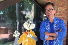 Mr Abdul Kadir Samin posing outside the shop where he works, Bugs Bunny Barber.
Defence Minister Dr Ng En Hen has posted on his Facebook that Mr Abdul Kadir had cut his hair.