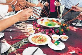 CHANGES: Your traditional yusheng this year may not come with raw salmon. 