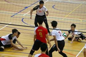 BEATEN: Shuqun Secondary School&#039;s B boys volleyball team (in white) could not stiop Bukit Panjang Government High School (in red) in yesterday&#039;s West Zone final.  