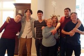 BOND: Actor-host George Young (third from left) with his brothers (from left) Paul, Anthony and Andrew, with their grandmother and parents.