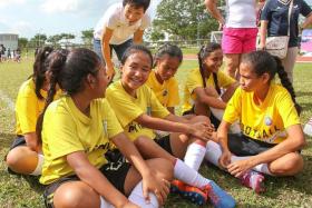 VIP VISIT: Minister Grace Fu chatting with the girls who attended yesterday&#039;s Women&#039;s Football Day.