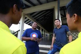 ADVICE: Former gang members Azmi Abdul Rahman (left) and Kim Whye Kee (right) speaking to participants of Camp ACE VIII.