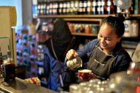 TEAMWORK: Baristas and waiters of I Am... cafe. 