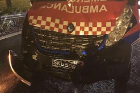 DAMAGE: The ambulance (above) collided into the white van.