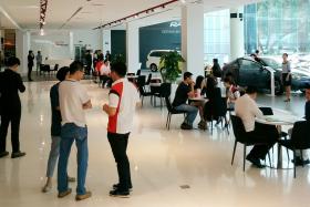 INTEREST: The crowd at a Toyota showroom yesterday. 