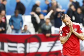 A dejected Marko Arnautovic contemplates Austria&#039;s 2-0 defeat to Hungary at Euro 2016.