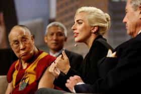 The Dalai Lama and singer Lady Gaga appear together for a question and answer session on "the global significance of building compassionate cities" at the U.S. Conference of Mayors 84th Annual Meeting in Indianapolis, Indiana United States, June 26, 2016.