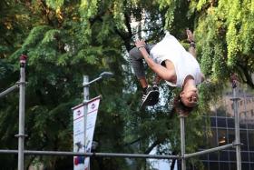 UPSIDE DOWN: (Above) A parkour enthusiast showing what he can do.