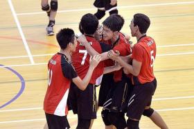 VICTORY: The boys from Shuqun Secondary School celebrating after they forged a 2-1 comeback to beat Hwa Chong Institution yesterday to claim the gold in the South Zone volleyball C Division boys&#039; final.  