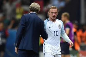 STEPPING IN: England captain Wayne Rooney (No. 10) has revealed that it was his decision to stop Harry Kane from taking corners at Euro 2016, not Roy Hodgson.