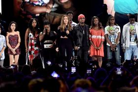 Actress Jessica Alba (centre) speaks out against gun violence with victims and victims' families of gun violence attacks onstage during Teen Choice Awards 2016 at The Forum on July 31, 2016