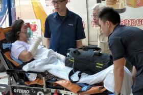 HURT: An employee at Xin Mei Congee stall had burns on her arms and hands and was one of four people injured in the fire at the Old Airport Road Food Centre.