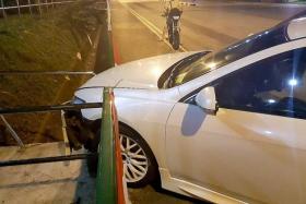 CRASH: Mr Vasily&#039;s car hit a kerb and a railing at the junction of Mei Chin Road and Mei Ling Street when he was trying to overtake the car in front of him.