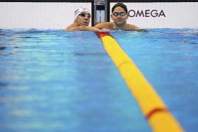 HE&#039;S COME A LONG WAY: Joseph Schooling, when he was 13, with his idol Michael Phelps eight years ago, and Schooling with Phelps in Rio (above), where the Singaporean will try to beat the swimming legend in the 100m butterfly final this morning.