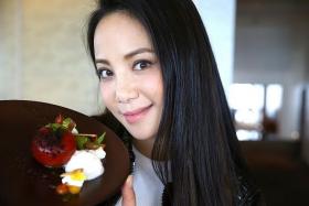 PRETTY: Fiona Xie and the Maple-Cured Rainbow Trout at French restaurant Jaan. 