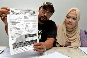 UPSET:Mr Muhammad Aslam and his fiancee, Ms Siti Fadilah, also believe they were issued fake receipts by Mr Sunato Zaidi.