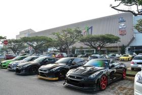 DISPLAY: Supercars lined up at the carpark make it easy for enthusiasts to admire them.