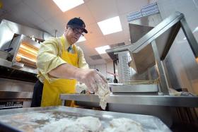 HANDS ON: Texas Chicken CEO Jim Hyatt preparing the fast-food restaurant&#039;s signature fried chicken.